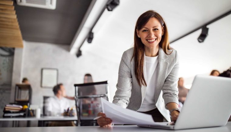 Smiling Woman Working in an Office