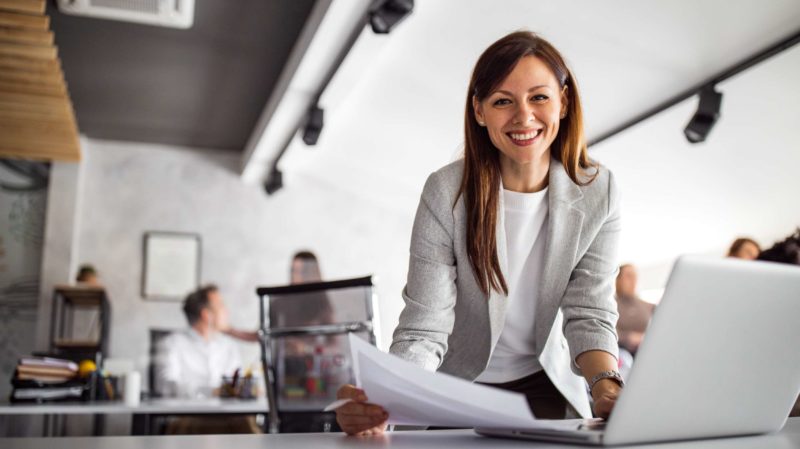 Smiling Woman Working in an Office