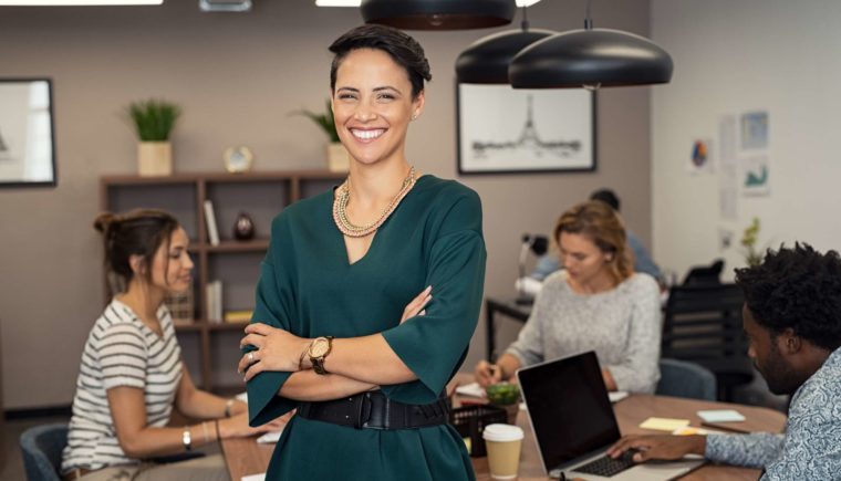 Smiling Woman Standing in an Office