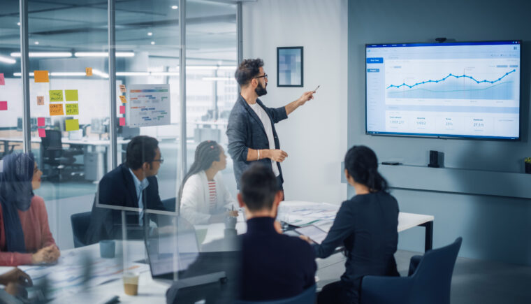A businessman leads a team meeting