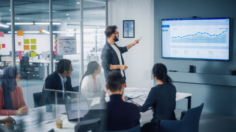A businessman leads a team meeting
