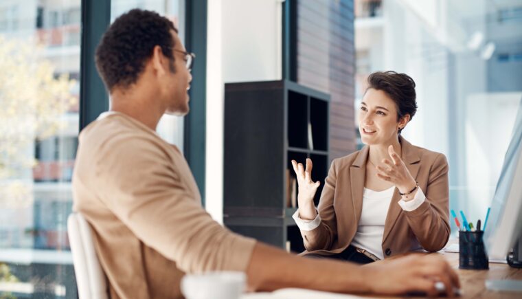 Colleagues having a discussion in an office