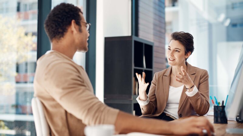 Colleagues having a discussion in an office