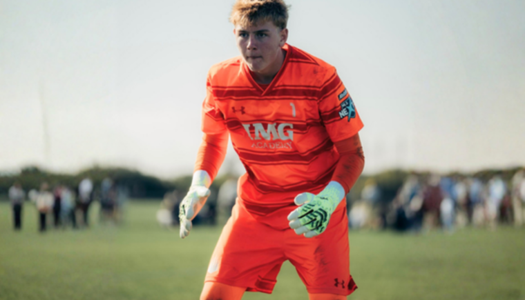 Boy goal tending in a soccer game