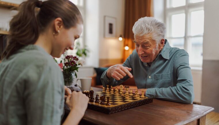 Mentor and mentee playing chess