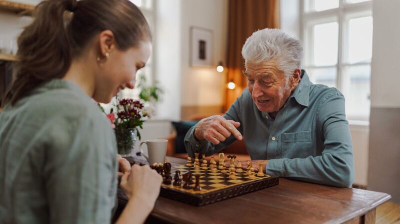 Mentor and mentee playing chess