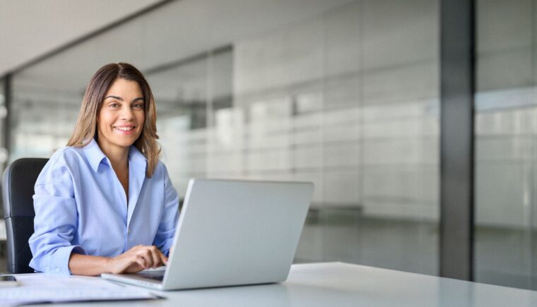 Woman working on a laptop at the office