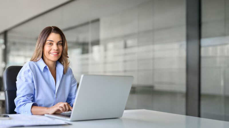 Woman working on a laptop at the office